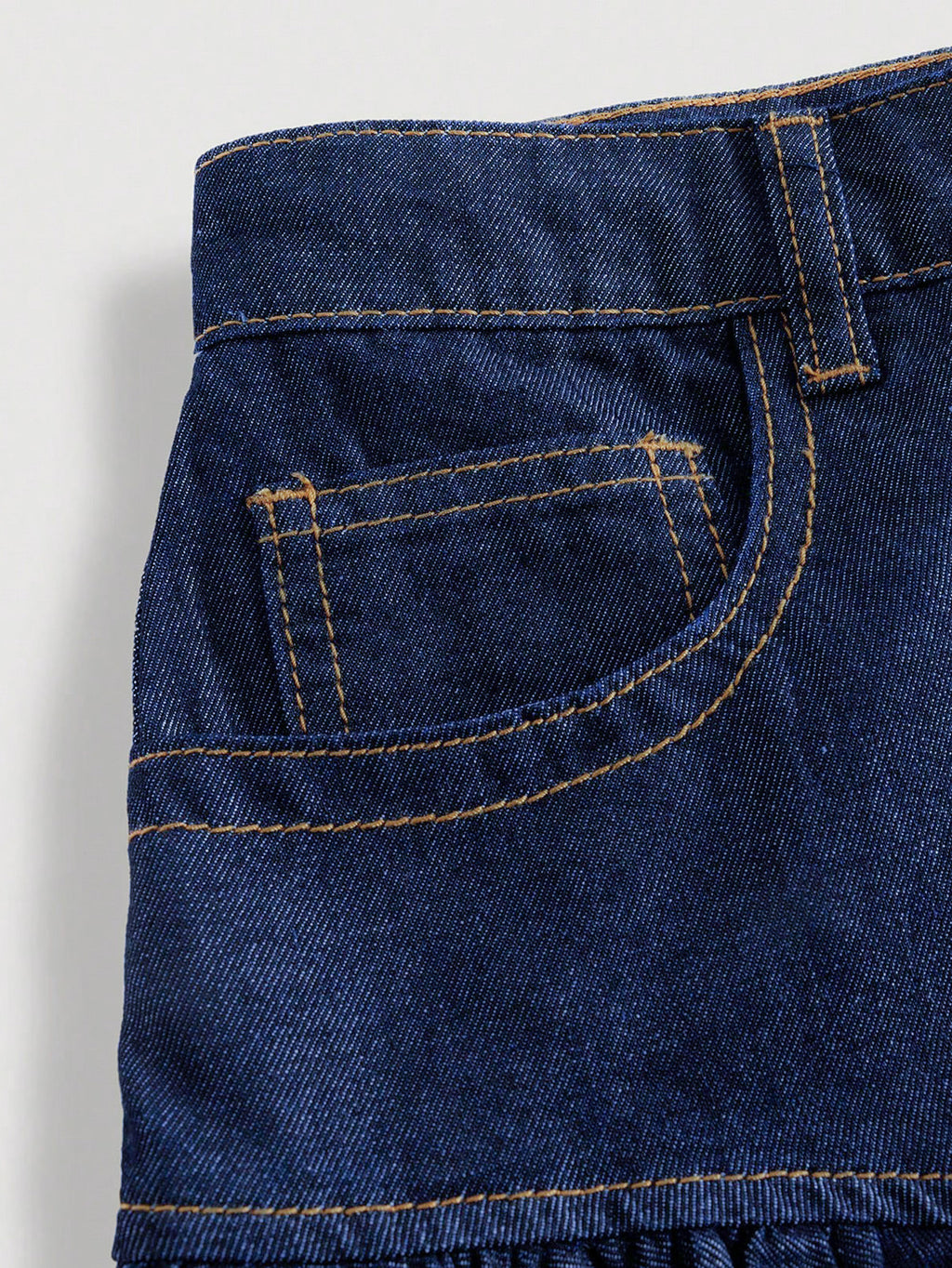 Jupe courte en jean taille haute à volants